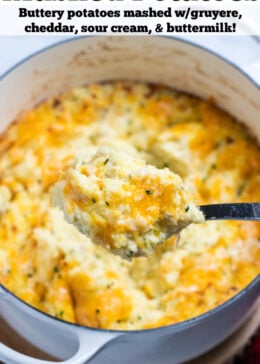 Pinterest pin with a spoon scooping cheesy mashed potatoes, with melty cheese pulling from the dish.
