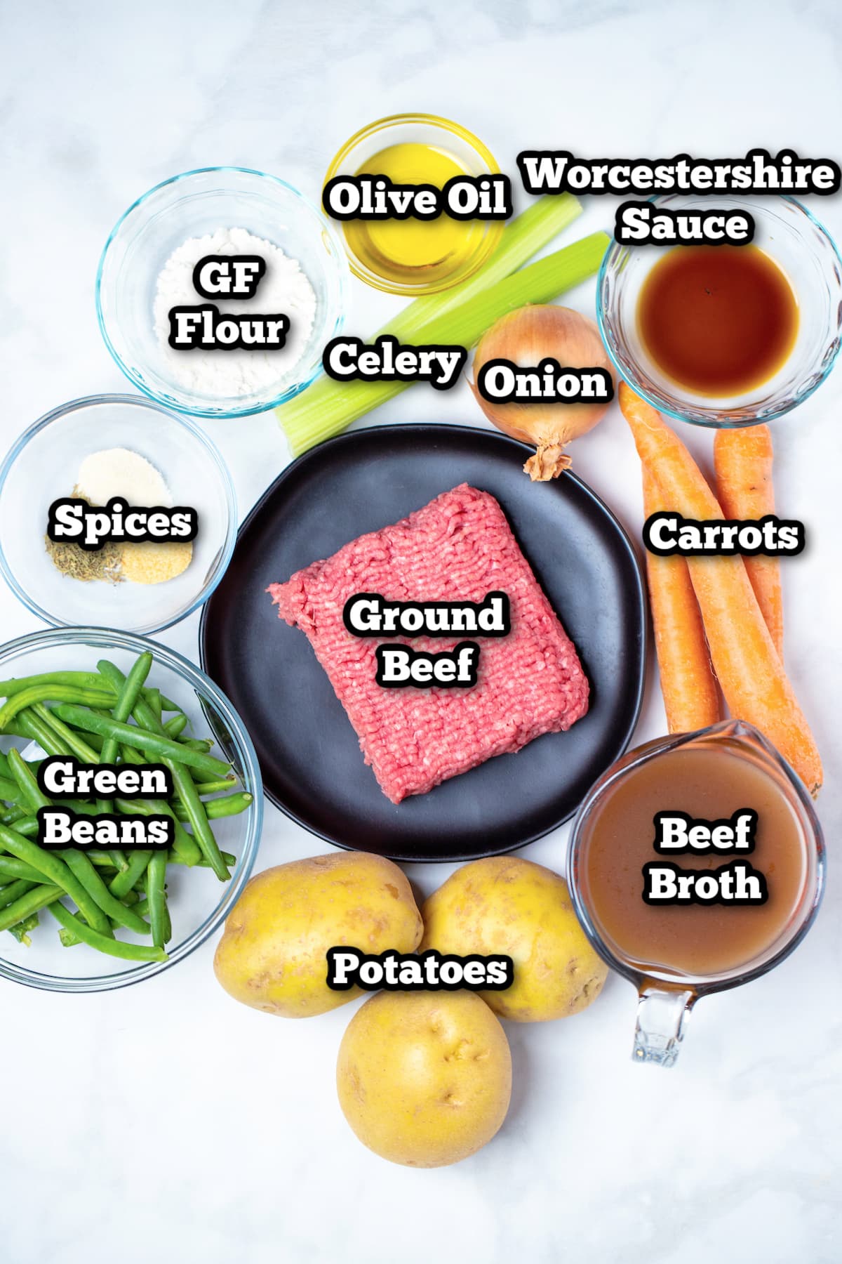 Individual ingredients for ground beef soup on a table.