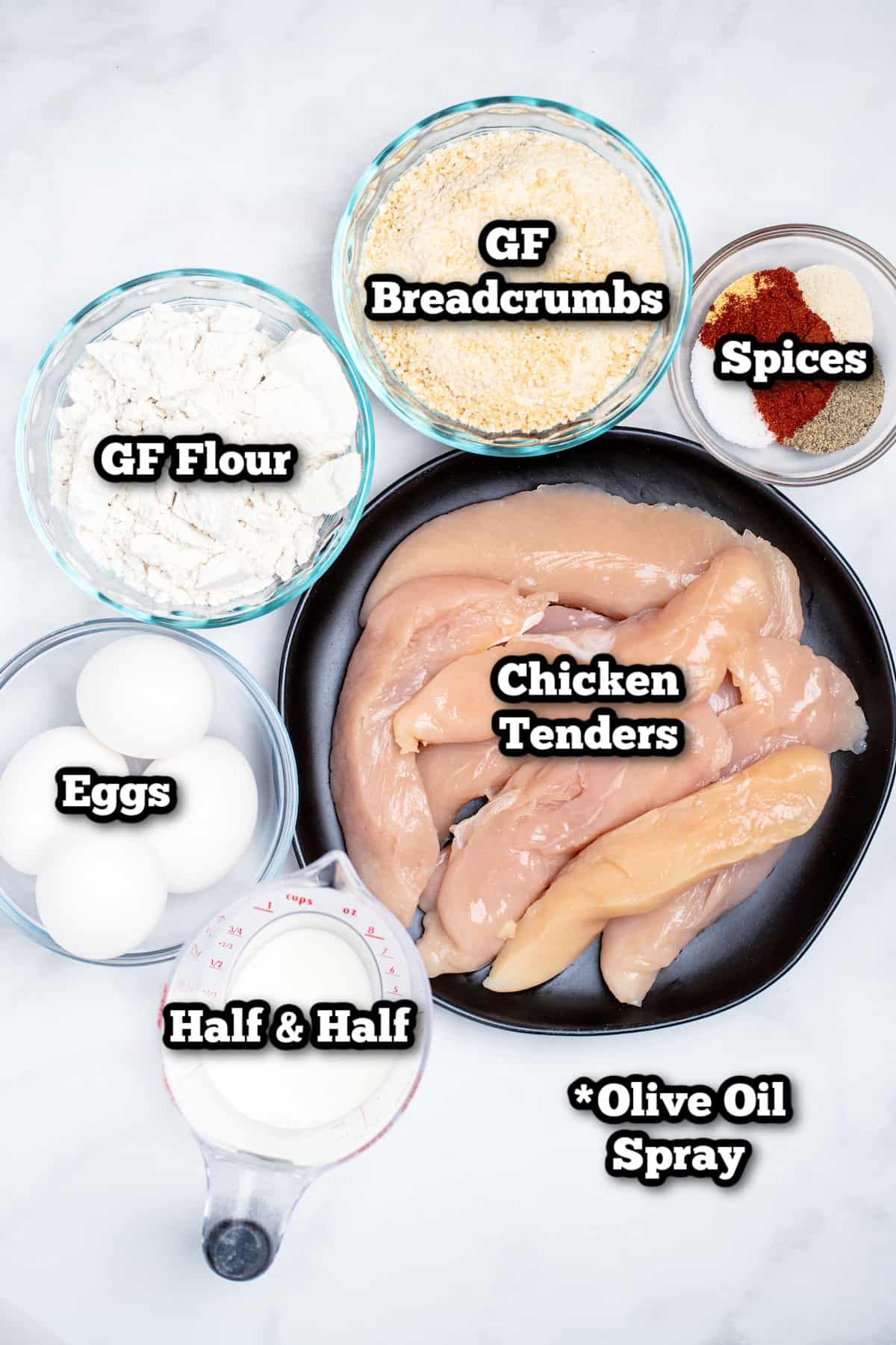 Individual ingredients for air fryer chicken tenders on a table.