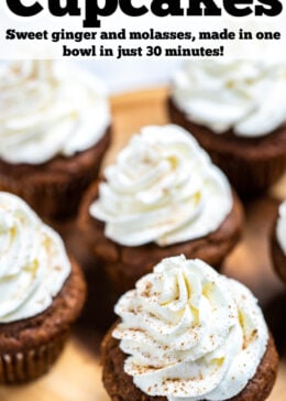 Pinterest pin with gingerbread cupcakes topped with frosting on a wooden cutting board and other cupcakes.