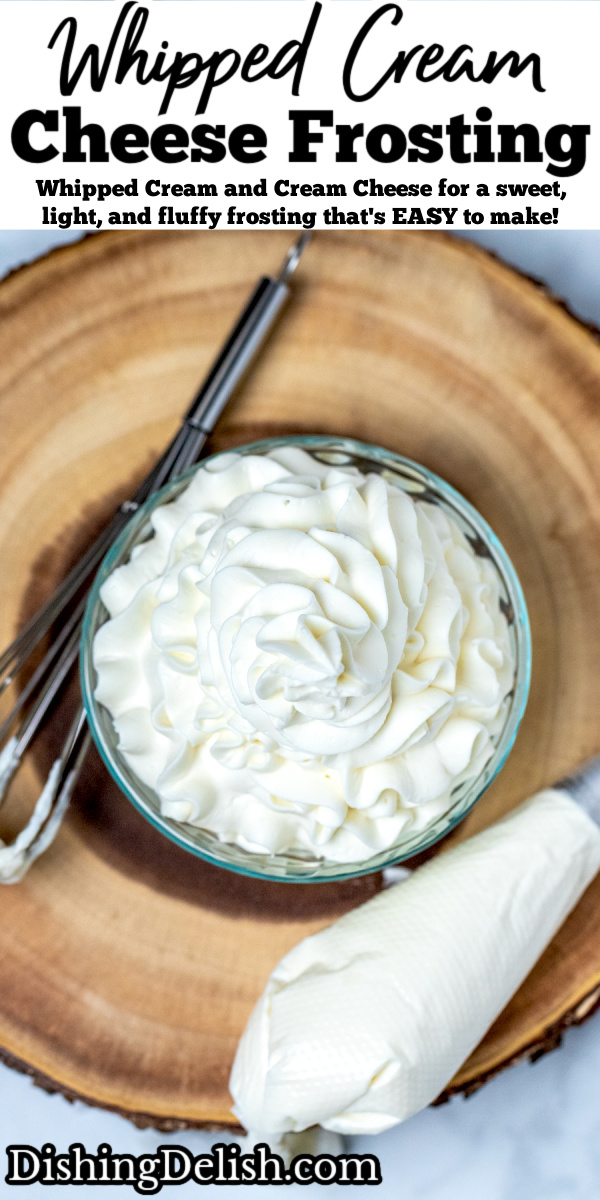 Pinterest pin with whipped cream cheese frosting piped into a glass bowl, with a whisk and a piping bag sitting on a wooden cutting board.