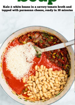 Pinterest pin with a pot of kale and white bean soup ingredients before being cooked with a spoon resting in the pot.