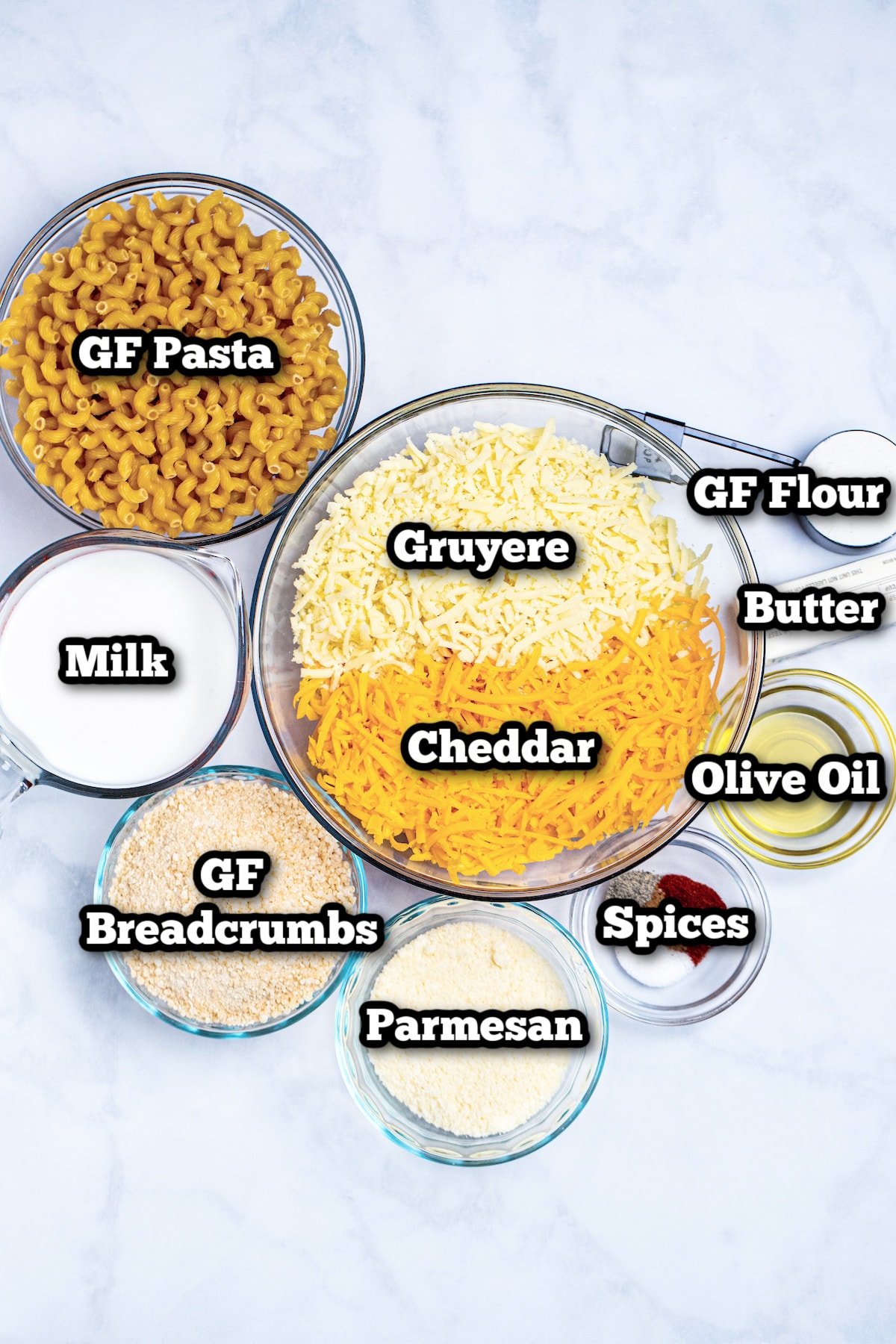 Individual ingredients for gluten free mac and cheese on a table.