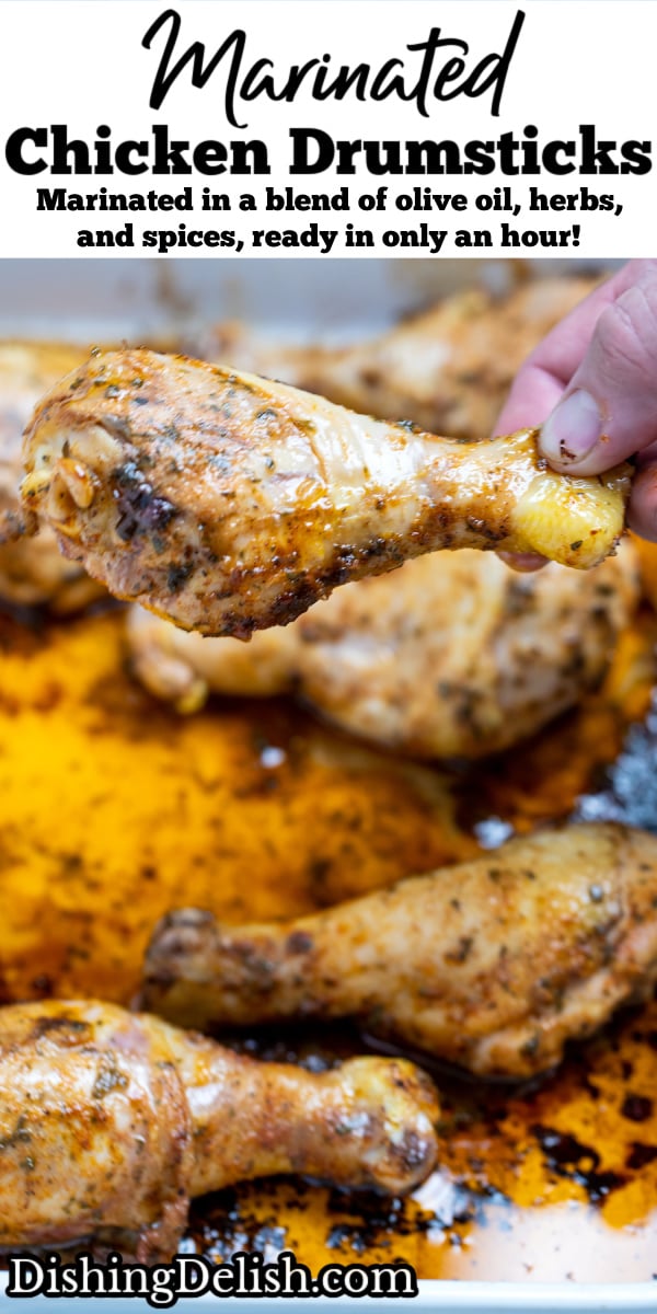 Pinterest pin with a baking dish with cooked chicken drumsticks covered in marinade with a hand taking a drumstick.