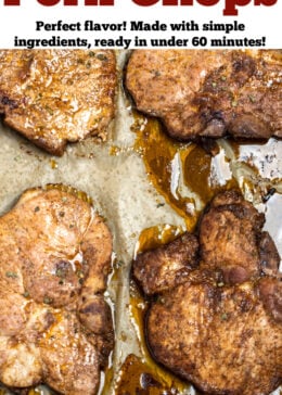 A pinterest pin with a sheet pan of cooked marinated pork chops on parchment paper.