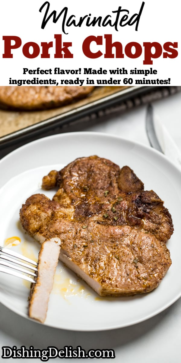 A pinterest pin with marinated pork chop on a plate with a fork holding a slice of chop, next to a sheet pan with other cooked pork chops.