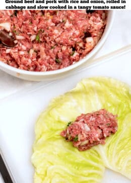 Pinterest pin with a bowl of meat mixture behind a cutting board with a cabbage leaf cut to lay flat, with meat on top ready to roll into a stuffed cabbage roll.