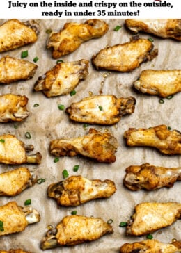 Pinterest pin with instant pot chicken wings on a sheet pan lined with parchment paper topped with green onions.