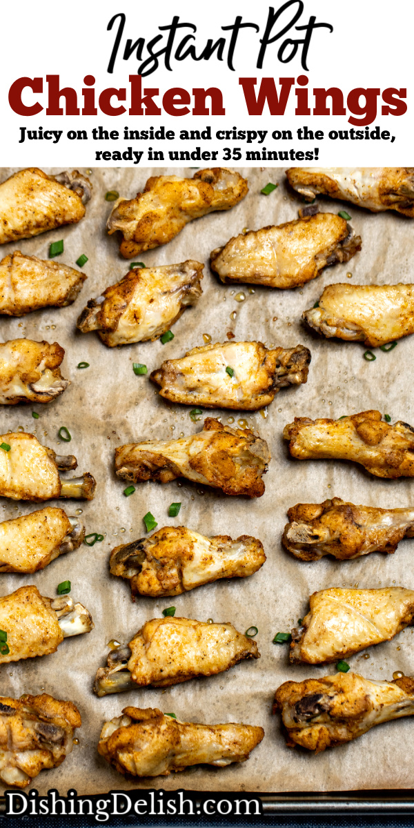 Pinterest pin with instant pot chicken wings on a sheet pan lined with parchment paper topped with green onions.