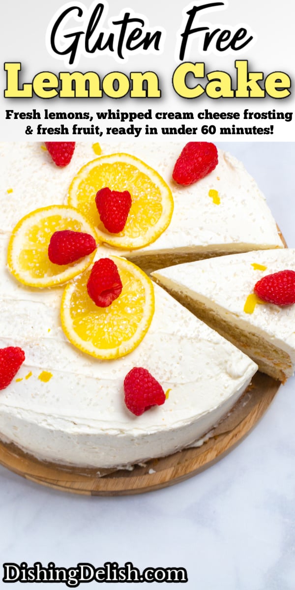 Pinterest pin with a lemon cake topped with lemon slices, sprinkles, and raspberries on a wooden cake stand with a slice being lifted out of it.
