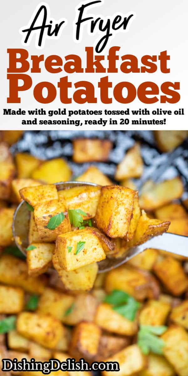 A spoon lifting air fryer breakfast potatoes out of an air fryer basket.