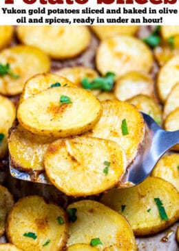A pinterest pin with a sheet pan of baked potato slices topped with fresh parsley, with a spatula lifting some up.