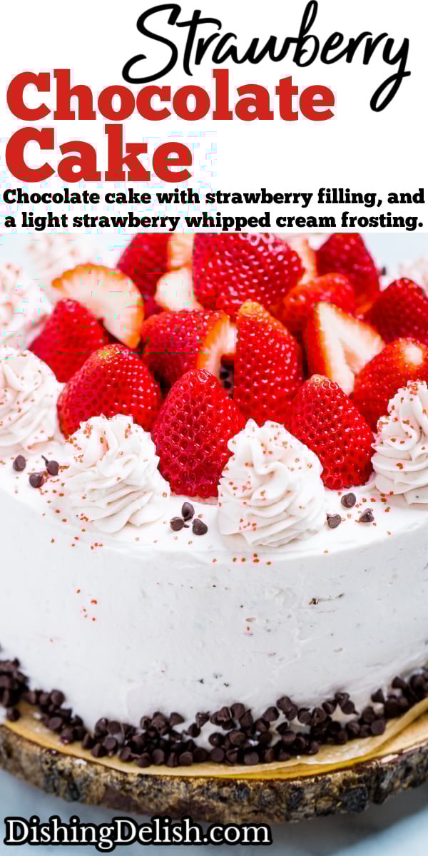 Pinterest pin with a strawberry chocolate cake on a wooden cake stand, decorated with mini chocolate chips and frosting dolloped on top with fresh whole strawberries.