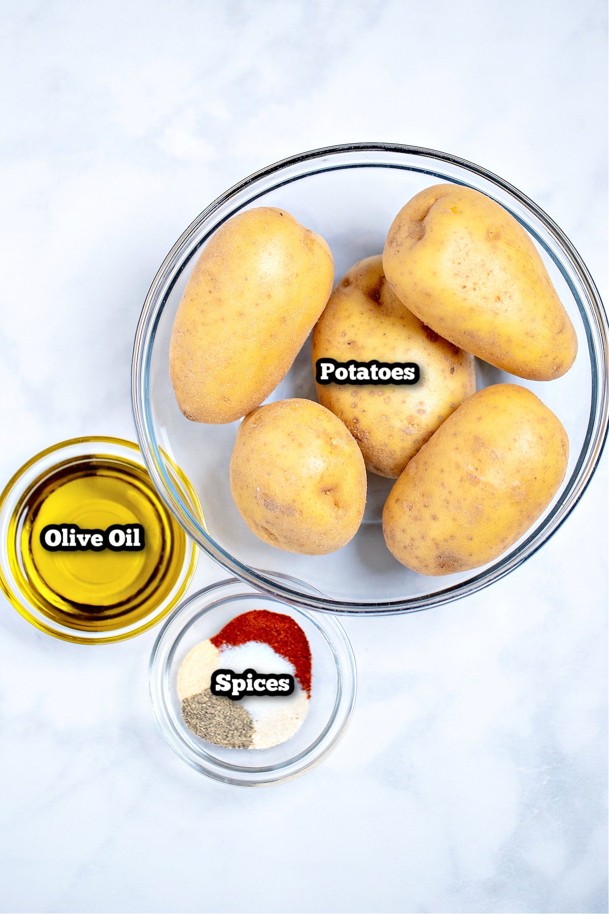 Individual ingredients for baked potato slices.