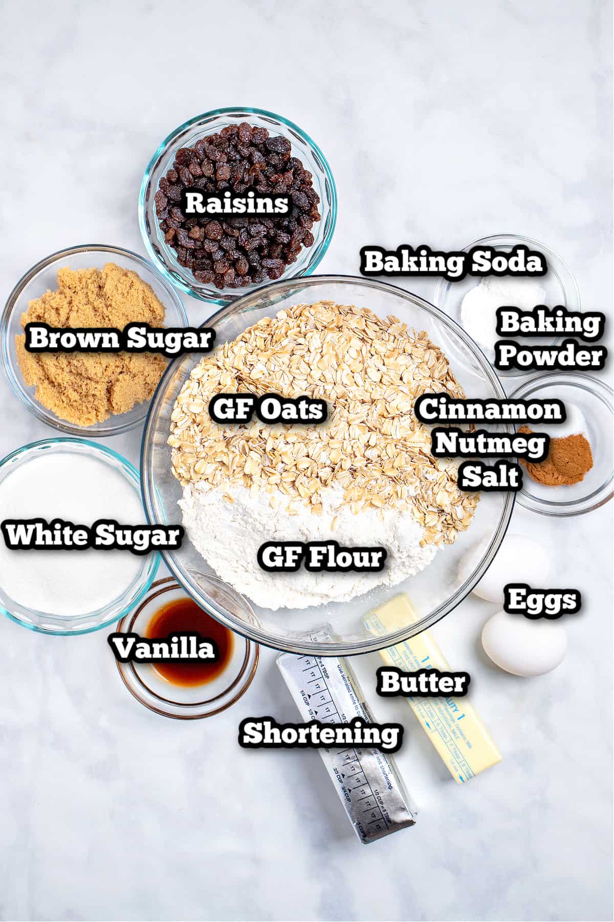 Individual ingredients for gluten free oatmeal cookies on a table.