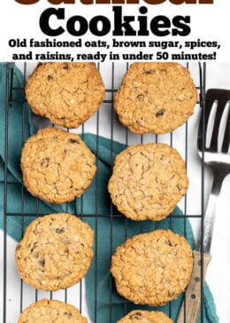 A pinterest pin with gluten free oatmeal cookies on a cooling rack above a towel next to a spatula.