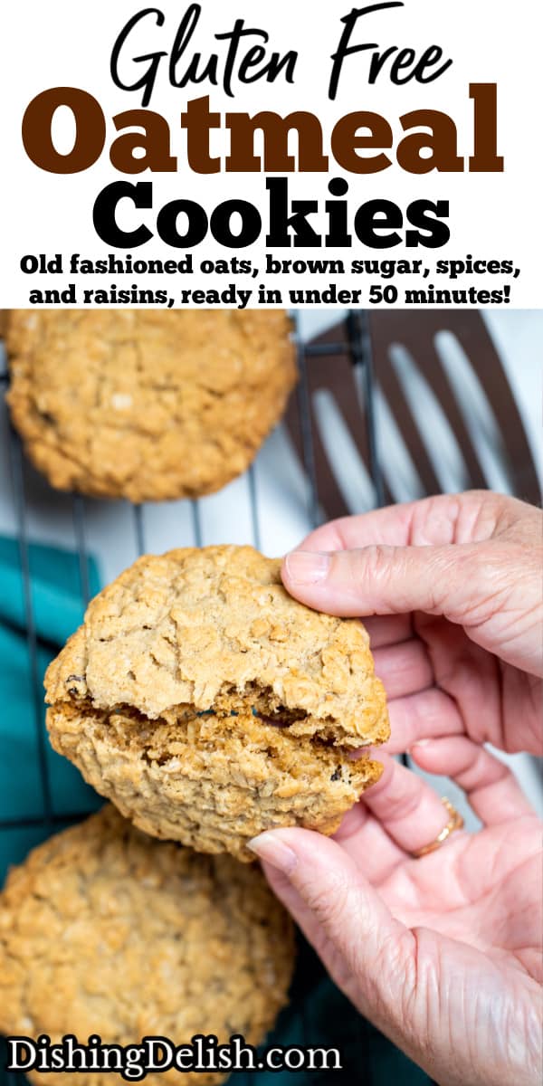 Pinterest pin with hands breaking a cookie in half over a cooling rack of gluten free oatmeal cookies.