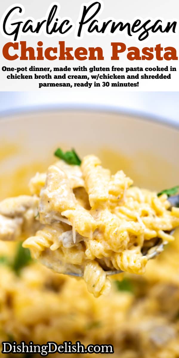 Pinterest pin with a spoonful of garlic parmesan chicken pasta being held over a dutch oven full of pasta.