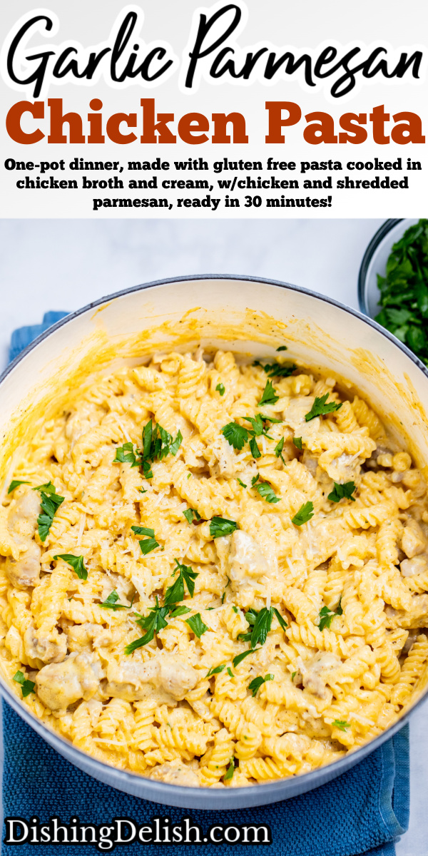 Pinterest pin with a dutch oven resting on a kitchen towel on the table, full of garlic parmesan chicken pasta topped with fresh parsley.