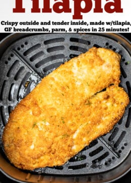 A piece of cooked breaded tilapia in an air fryer basket.