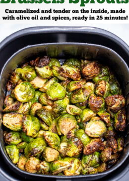 Pinterest pin with an air fryer basket full of fully cooked Brussels sprouts.