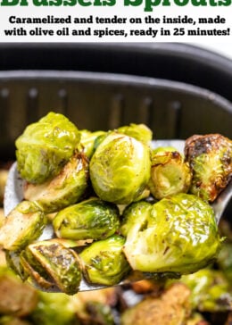 Pinterest pin with a spatula lifting Brussels sprouts out of an air fryer basket.
