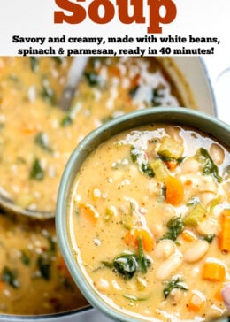 Pinterest pin with a hand holding a bowl of white bean soup over a pot of soup with a ladle in it.