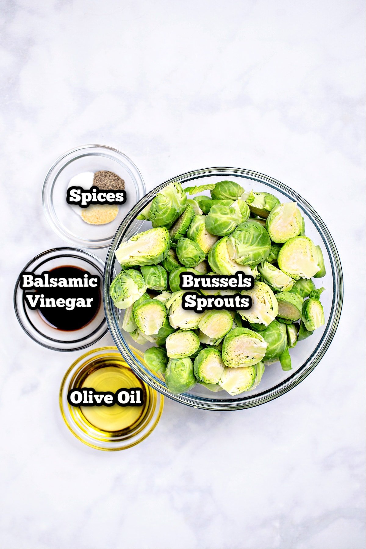 Individual ingredients for air fryer Brussels sprouts on a table.