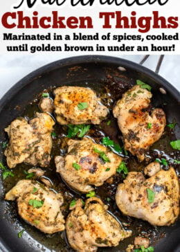 Pinterest pin with Greek marinated chicken thighs in a skillet topped with fresh parsley.