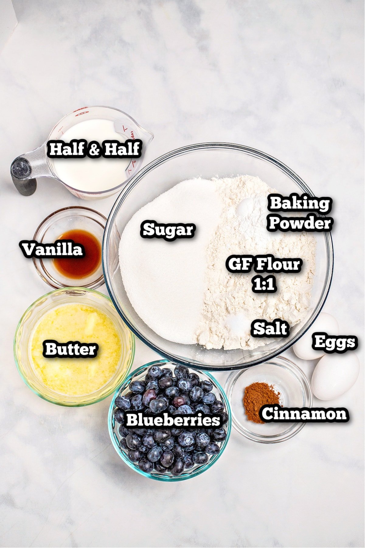 Individual ingredients for gluten free blueberry muffins on a table.