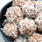 Peanut butter protein balls in a bowl on a table.