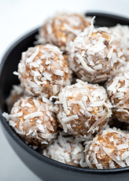Peanut butter protein balls in a bowl on a table.