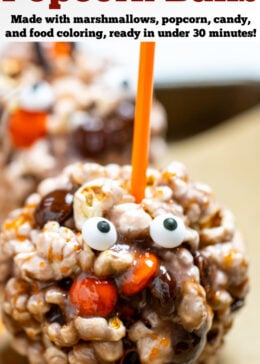 Pinterest pin with Halloween popcorn ball on a sheet pan surrounded by orange sprinkles.