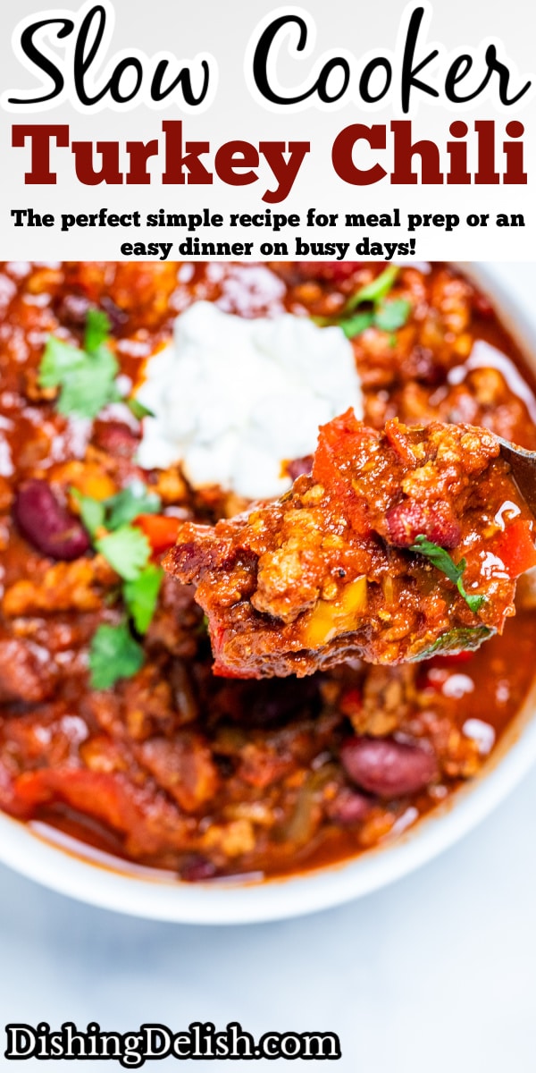 Pinterest pin with a spoon scooping turkey chili out of a bowl of chili topped with sour cream.