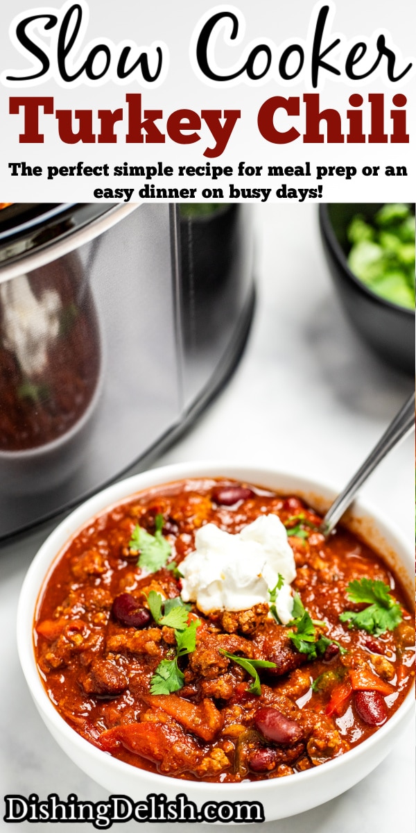 Pinterest pin with a bowl of turkey chili in front of a crockpot topped with fresh cilantro and sour cream.