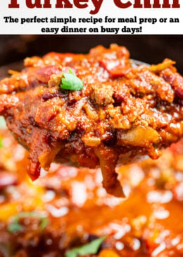 Pinterest pin with a ladle scooping slow cooker turkey chili out of a slow cooker. The chili is topped with fresh cilantro.