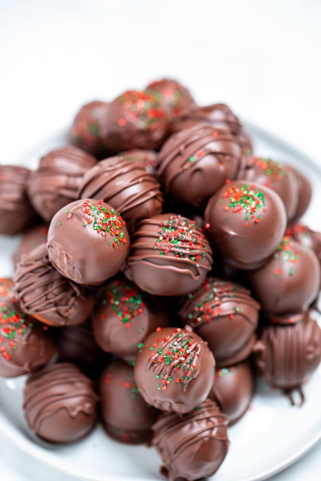 Chocolate Covered Peanut Butter Balls • Dishing Delish