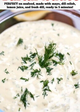 Pinterest pin with a bowl of homemade tartar sauce on a cutting board, topped with fresh dill, with a lemon wedge in the background.