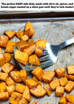 Pinterest pin with roasted sweet potato cubes on a sheet pan with parchment paper, being lifted up by a spatula.