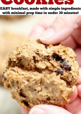 Pinterest pin with a picture of a hand holding an oatmeal breakfast cookie and breaking the cookie in half to show the chewy middle.