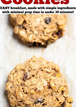 Pinterest pin with a photo of oatmeal breakfast cookies on a sheet pan with one cookie in primary focus.