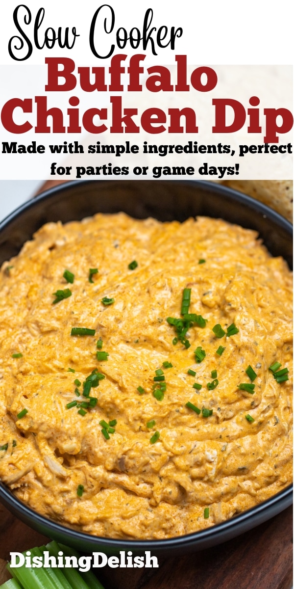 Pinterest pin with a bowl of slow cooker buffalo chicken dip topped with chives on a wooden cutting board next to celery and tortilla chips.