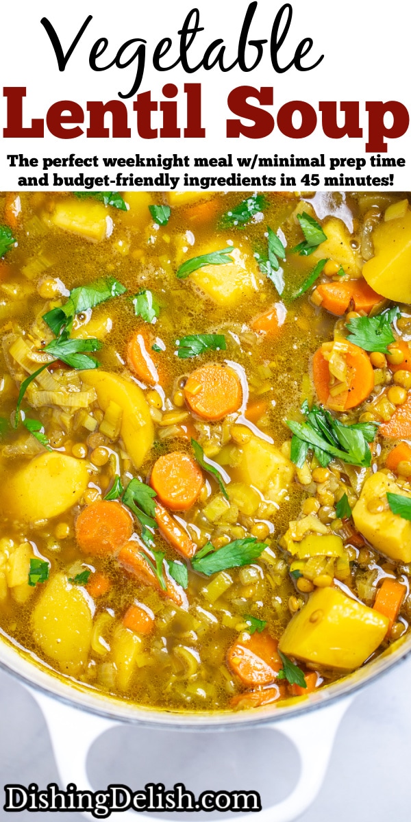 Pinterest pin with a dutch oven of lentil soup with carrots, potatoes, leeks, and lentils, topped with fresh chopped parsley.