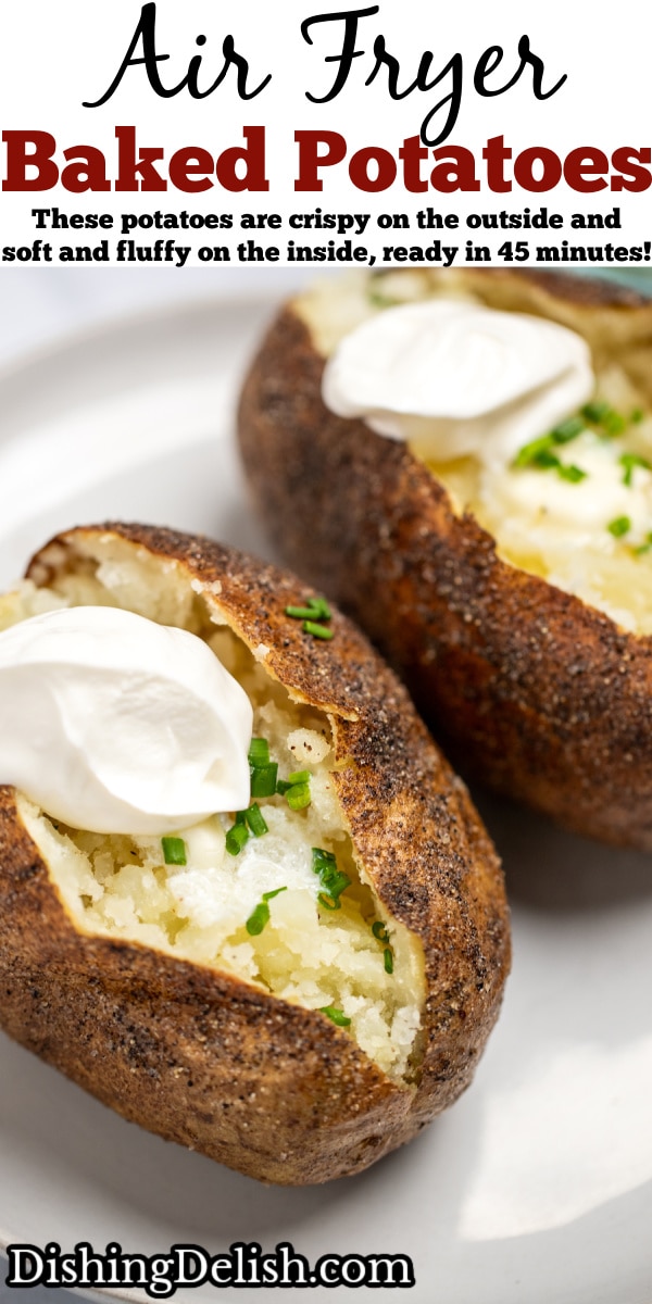 Pinterest pin with two baked potatoes topped with butter, chives, and sour cream on a plate.