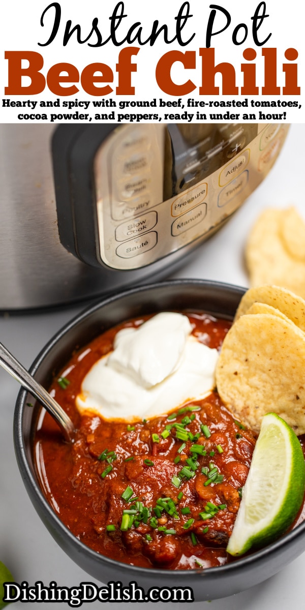 Pinterest pin with a bowl of chili with a spoon in it, topped with chopped chives, a lime wedge, and round tortilla chips, next to more lime wedges and tortilla chips, in front of an instant pot.