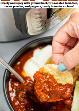 Pinterest pin with a bowl of chili with a spoon in it, topped with chopped chives, a lime wedge, and round tortilla chips, next to more lime wedges and tortilla chips, in front of an instant pot. A hand is holding a tortilla chip and scooping up chili.