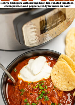 Pinterest pin with a bowl of chili with a spoon in it, topped with chopped chives, and round tortilla chips, next to tortilla chips, in front of an instant pot.