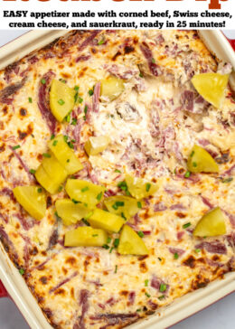 Pinterest pin with reuben dip topped with pickles in a baking dish on a table.