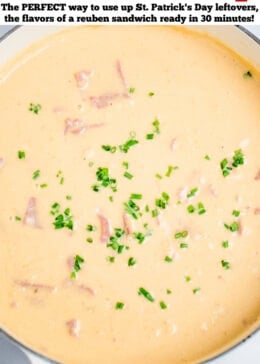 Pinterest pin with a dutch oven full of reuben soup topped with fresh chives sitting on a table.