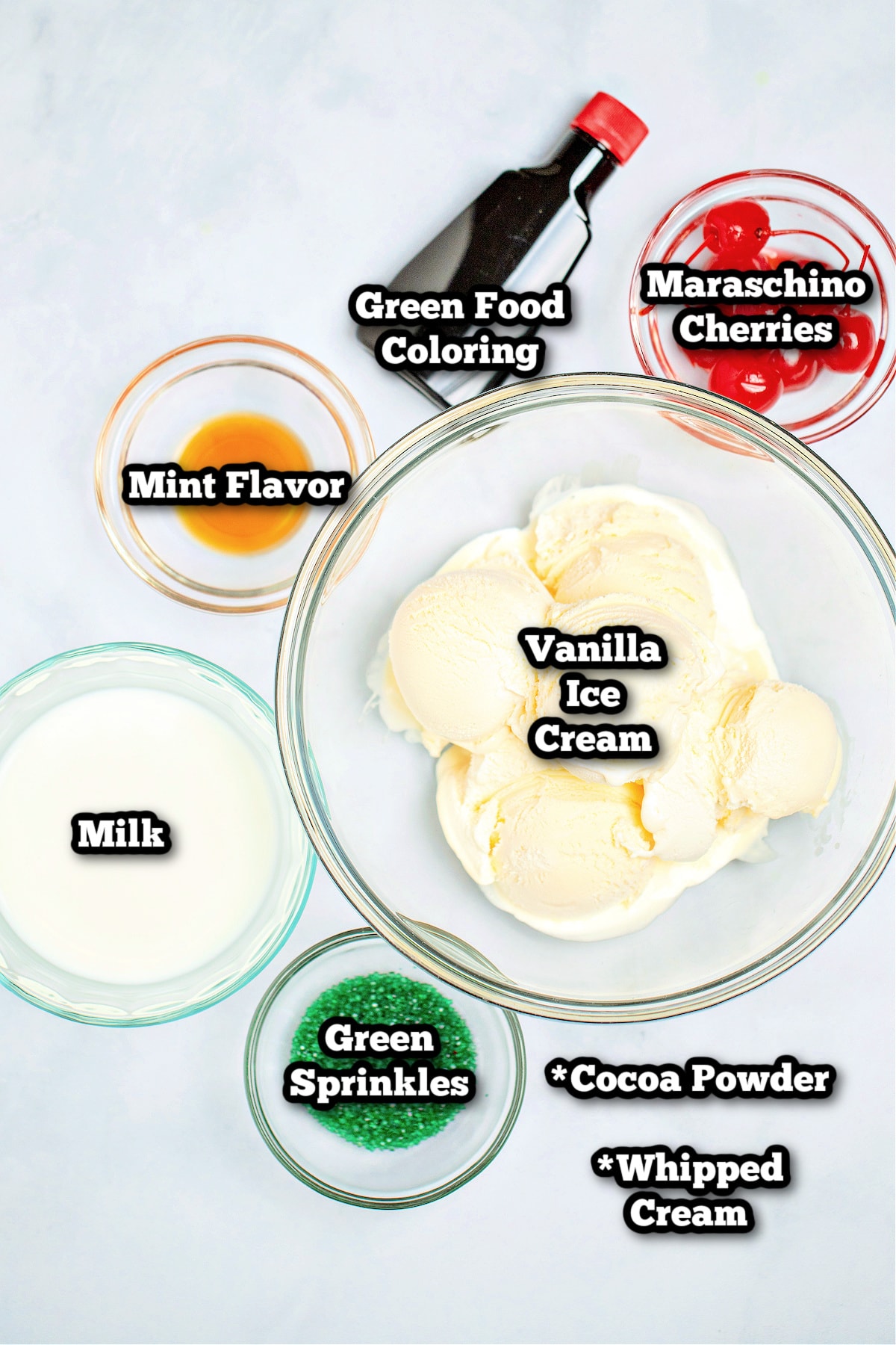 Individual ingredients for this shamrock shake recipe on a table.